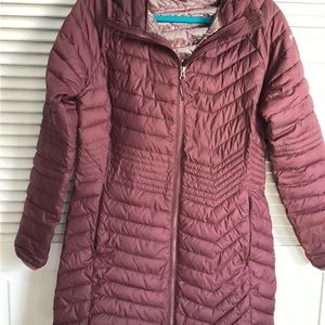 This is a beautiful Columbia jacket that is mauve in color.